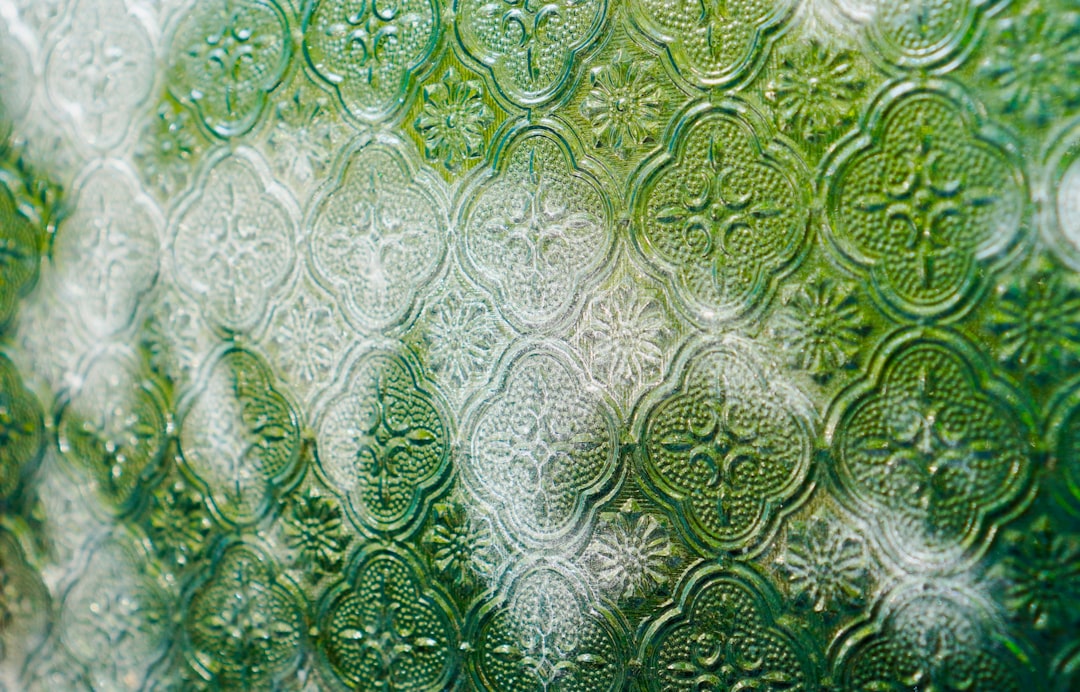 about-02 green-textured-glass-with-sunlight-filtering-through-ziftyip7n0